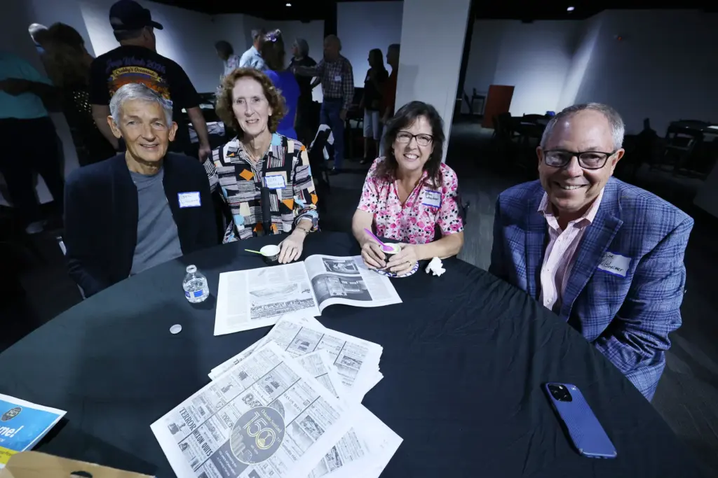 Former and current Orlando Sentinel journalists and employees are pictured...