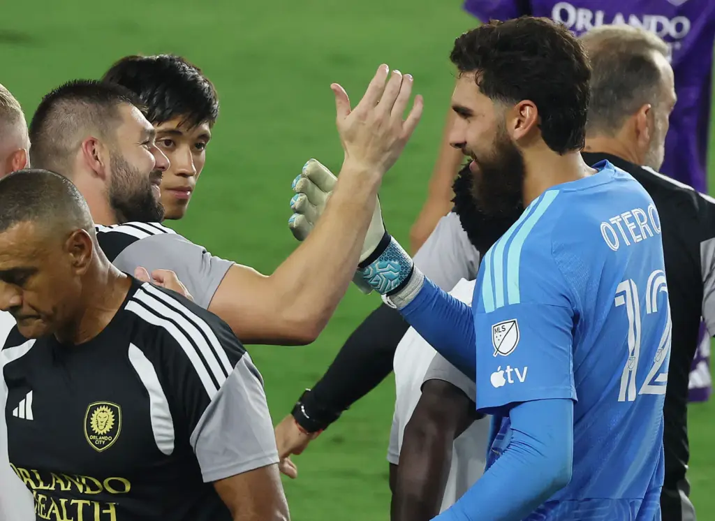 Orlando goalkeeper Javier Otero (12) celebrates with teammates and coaches...