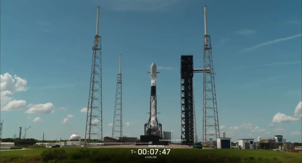 A SpaceX Falcon 9 rocket sits on the pad at...