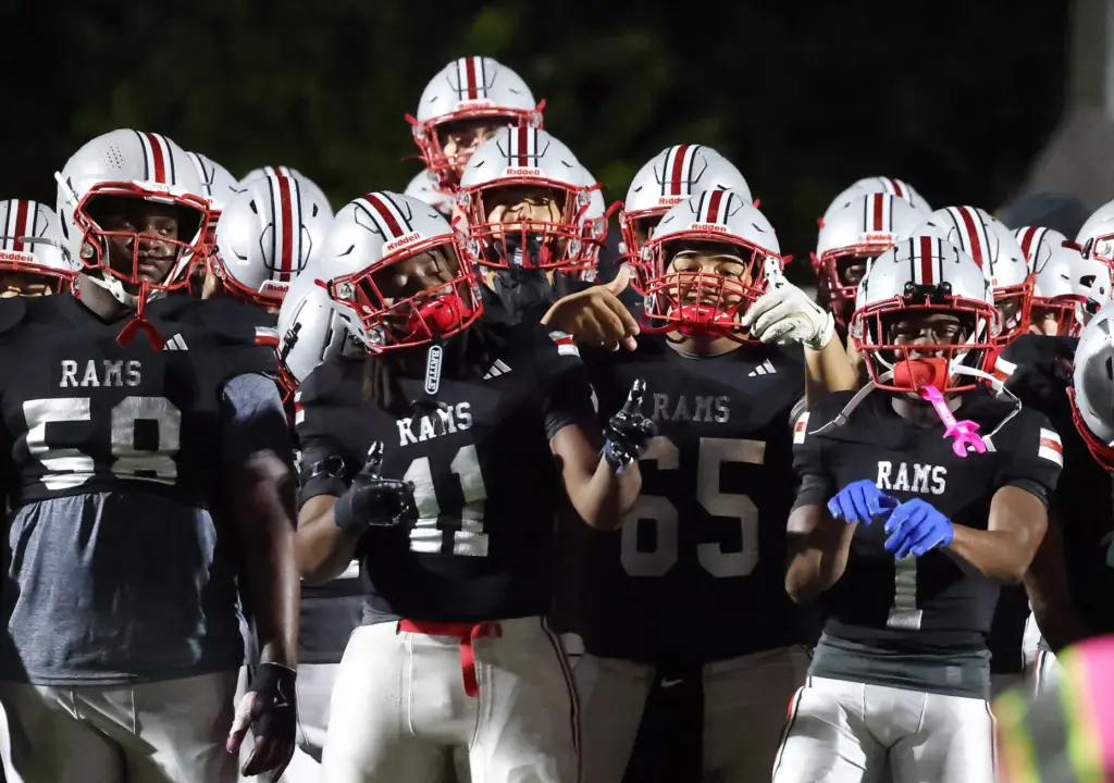 Lake Mary players cheer before the Osceola High at Lake...