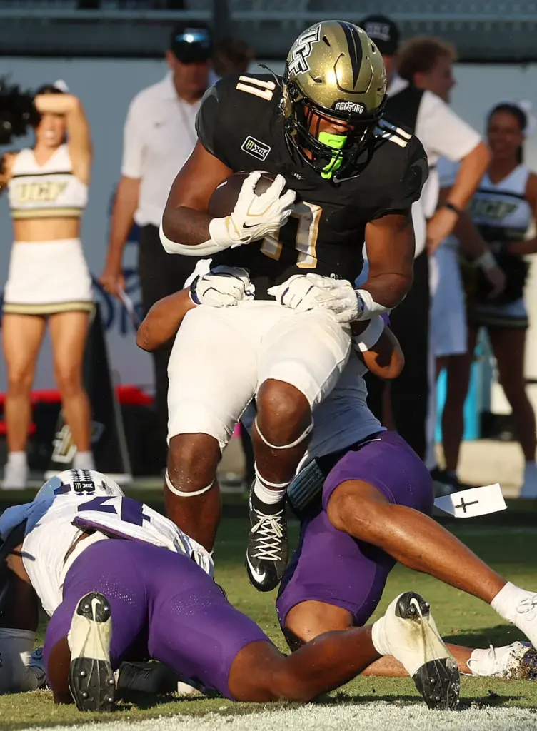 UCF running back Landen Chambers (11) runs into the endzone...