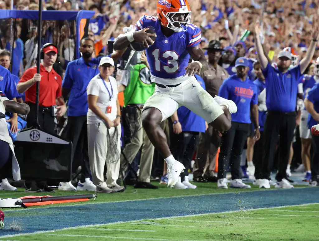 Florida running back Jadan Baugh (13) leaps for the endzone...