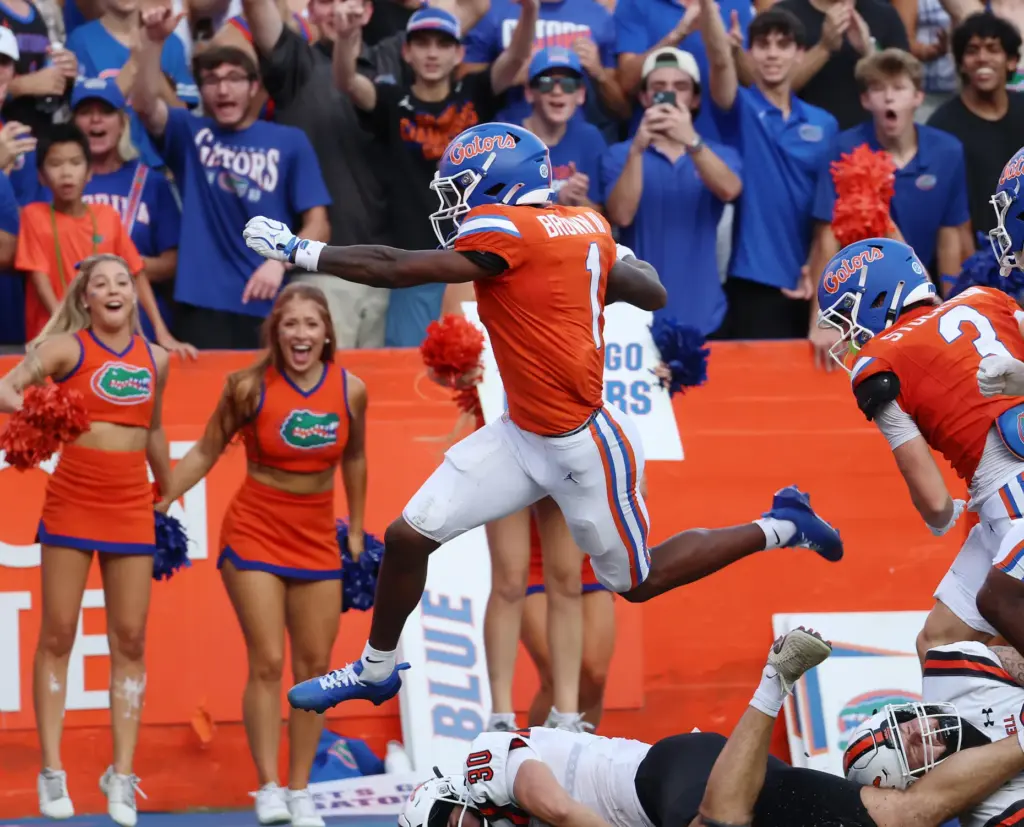 Florida receiver Vernell Brown III leaps into the endzone as...