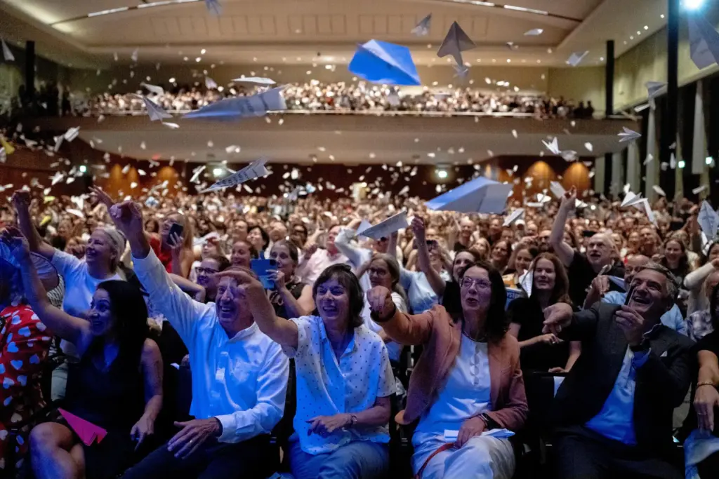 Spectators throw paper planes during the Ig Nobel Prize ceremony...