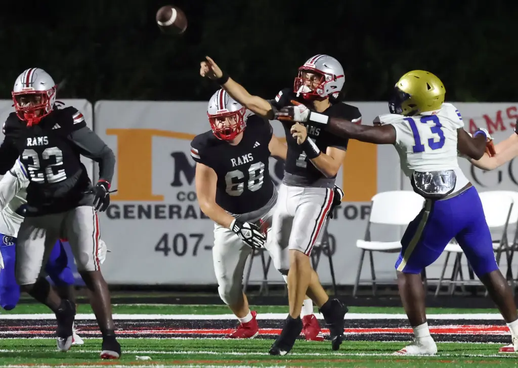 Lake Mary quarterback Remy Jarman (7) throws during the Osceola...