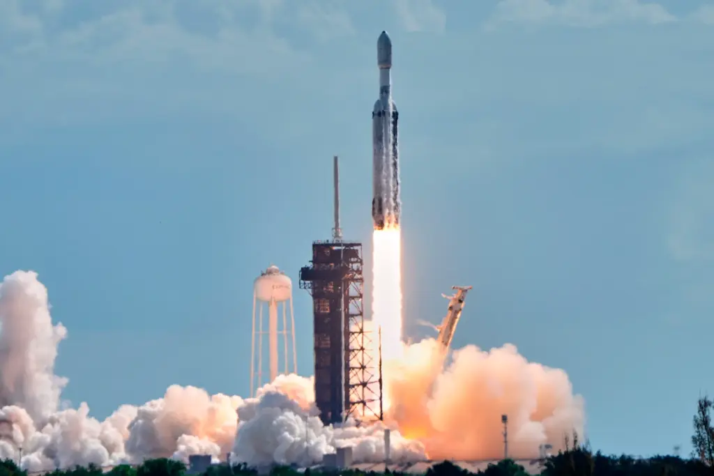A SpaceX Falcon Heavy rocket lifts off from pad 39A...