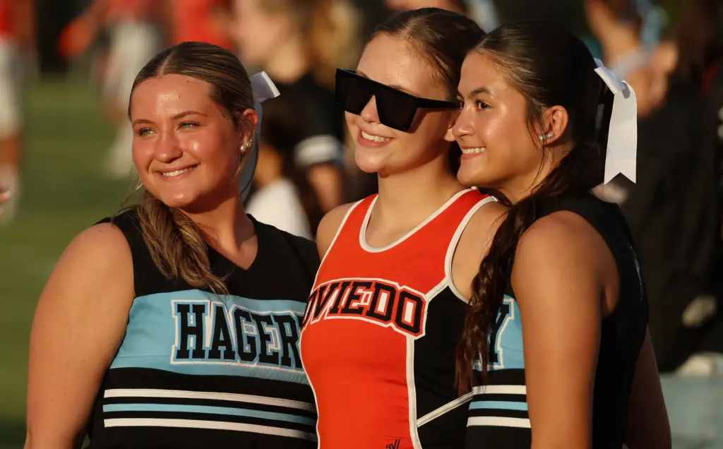Cheerleaders pose before the Oviedo High at Hagerty High varsity...