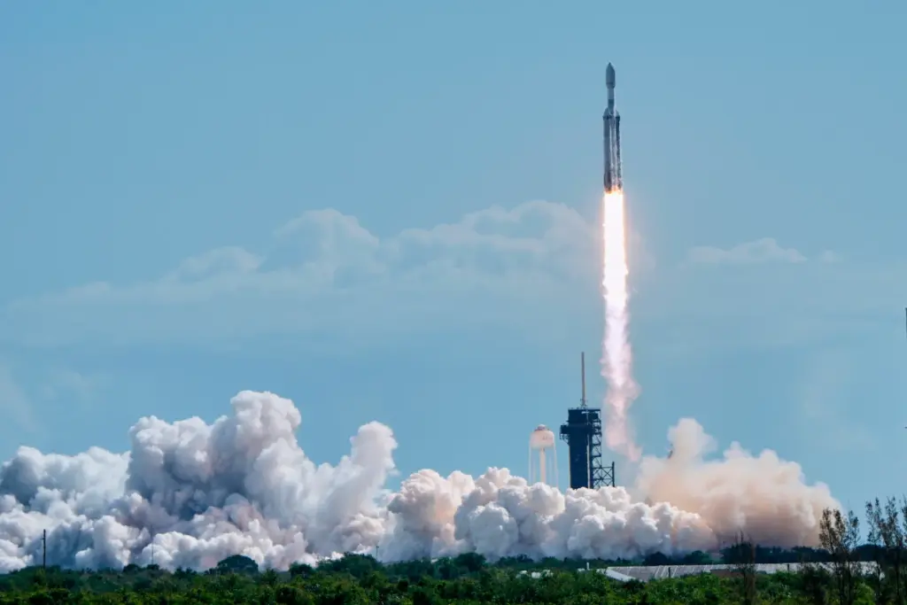 A SpaceX Falcon Heavy rocket lifts off from pad 39A...