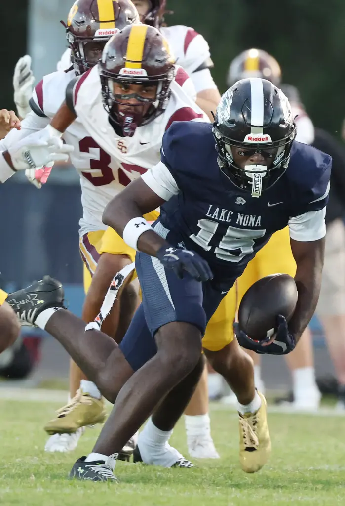 Lake Nona receiver Daryn Hodge Jr. runs after a catch...