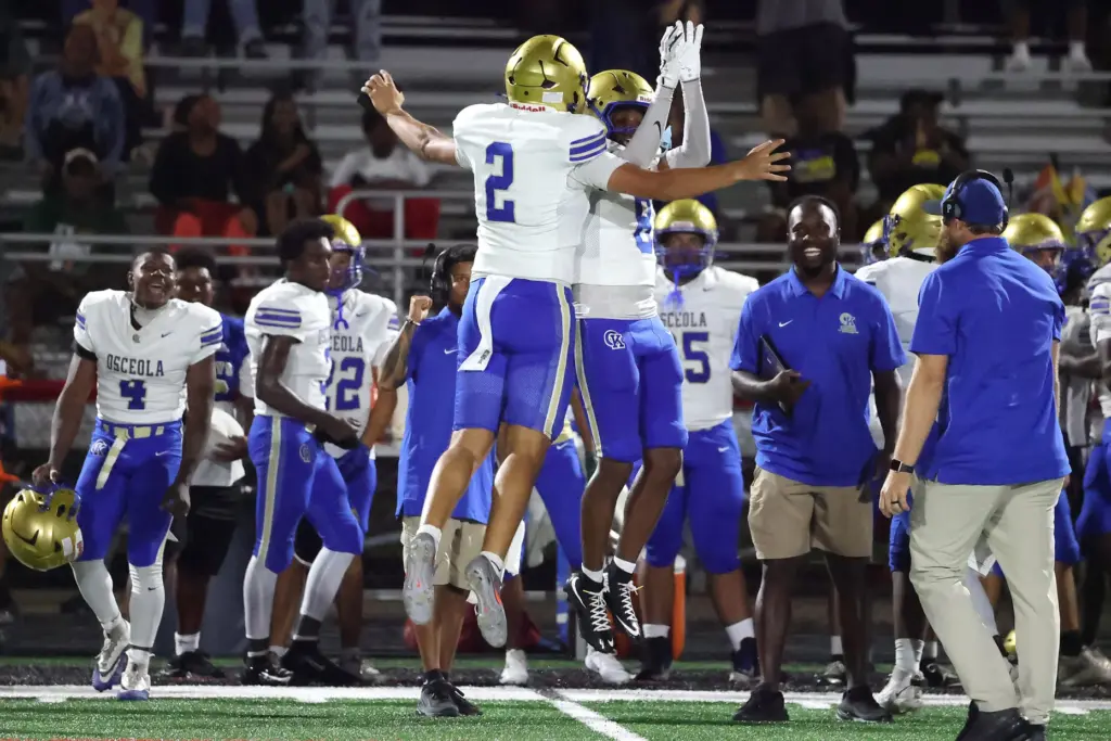 Osceola players Brayden Buehler (2) and Dorian Wright Jr. (8)...