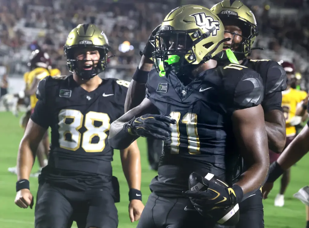 UCF running back Landen Chambers (11) celebrates with teammates during...