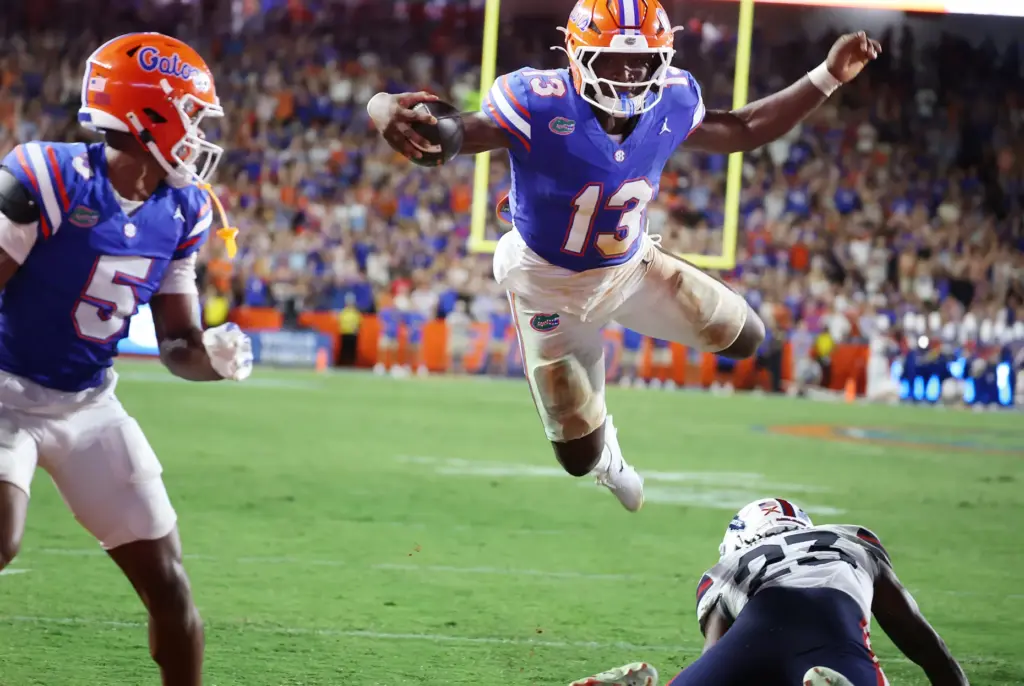 Florida running back Jadan Baugh (13) flies into the endzone...