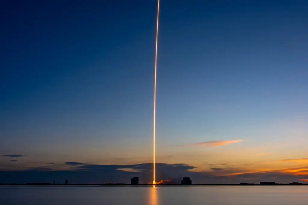A SpaceX Falcon 9 with a first-stage booster flying for...