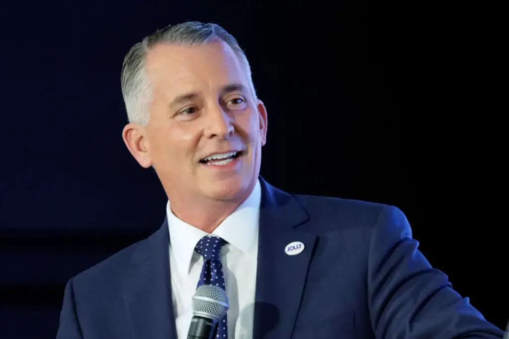 Democratic gubernatorial nominee David Jolly discusses issues with WLRN CEO Tom Hudson during the Sunshine Economy Summit on Wednesday. (Mike Stocker/South Florida Sun Sentinel)
