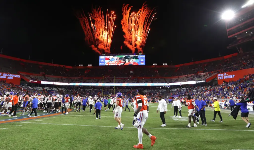 Florida players enter the field to celebrate after winning the...