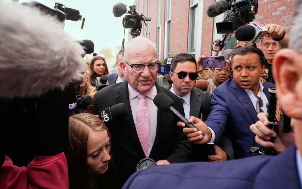 Kevin Reddington, defense attorney for Lindsay Clancy, walks through reporters and television cameras.