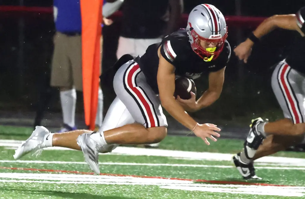 Lake Mary receiver Anthony Totin hangs on to a pass...