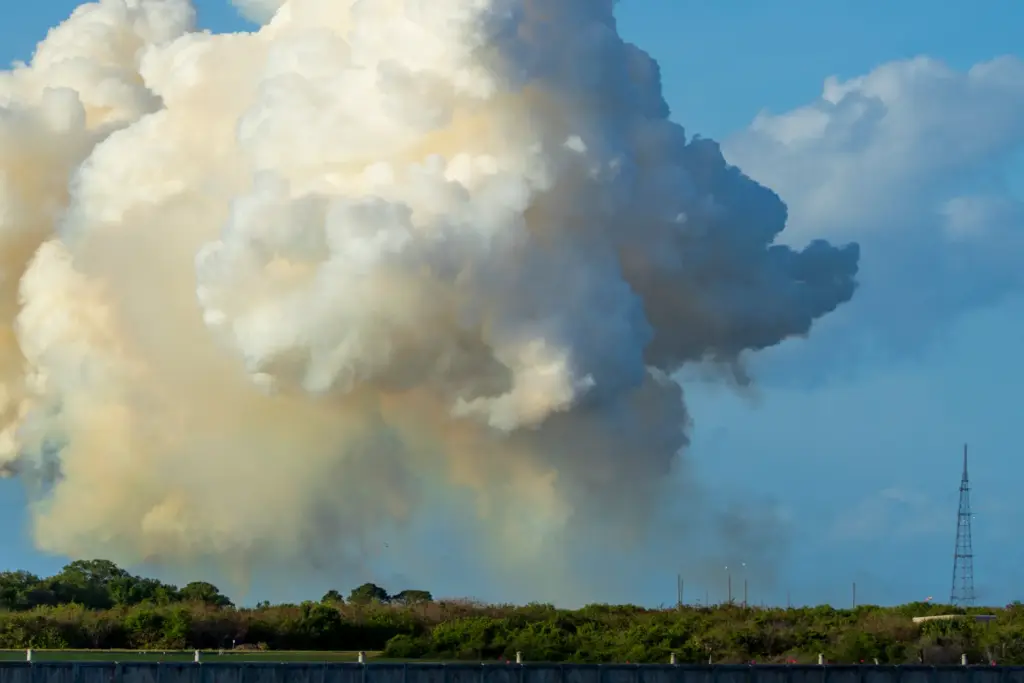 Smoke lingers in the air after the Space Launch System...