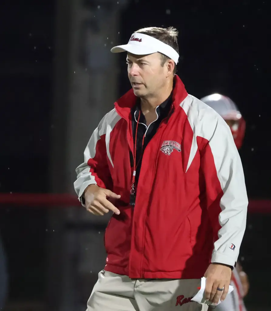 Lake Mary head coach Scott Perry coaches during the Osceola...