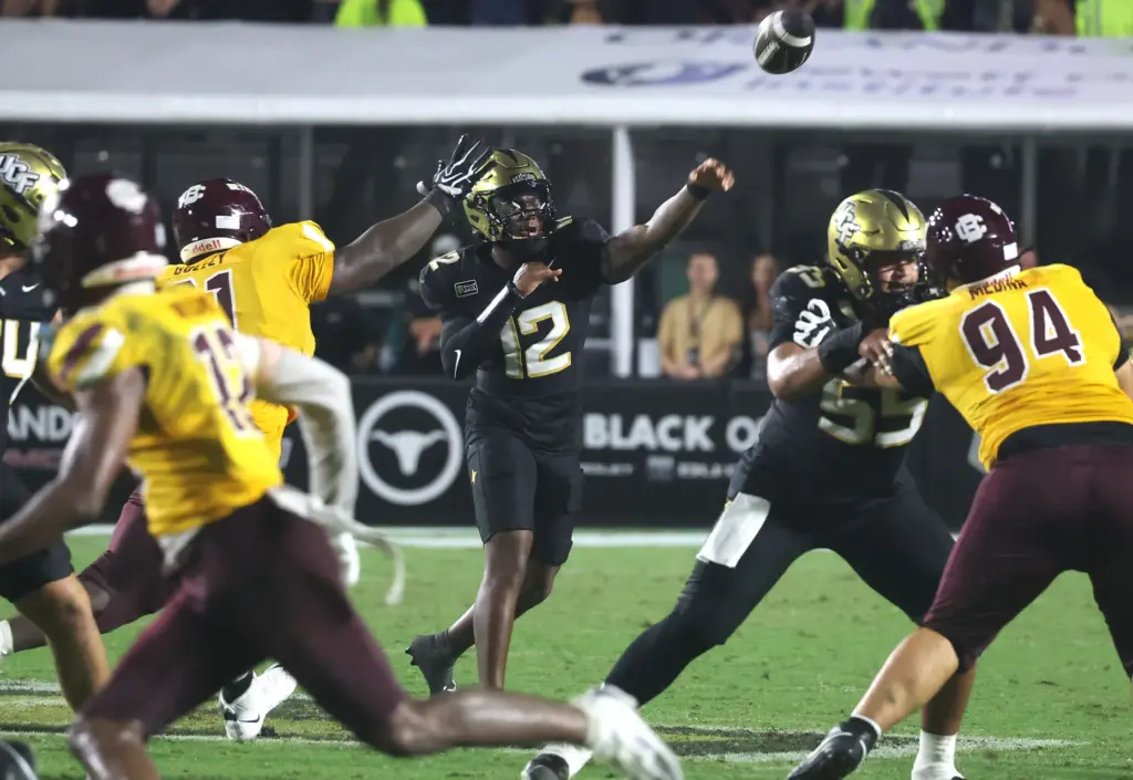 UCF quarterback Keyone Jenkins (12) throws during the Bethune-Cookman at...