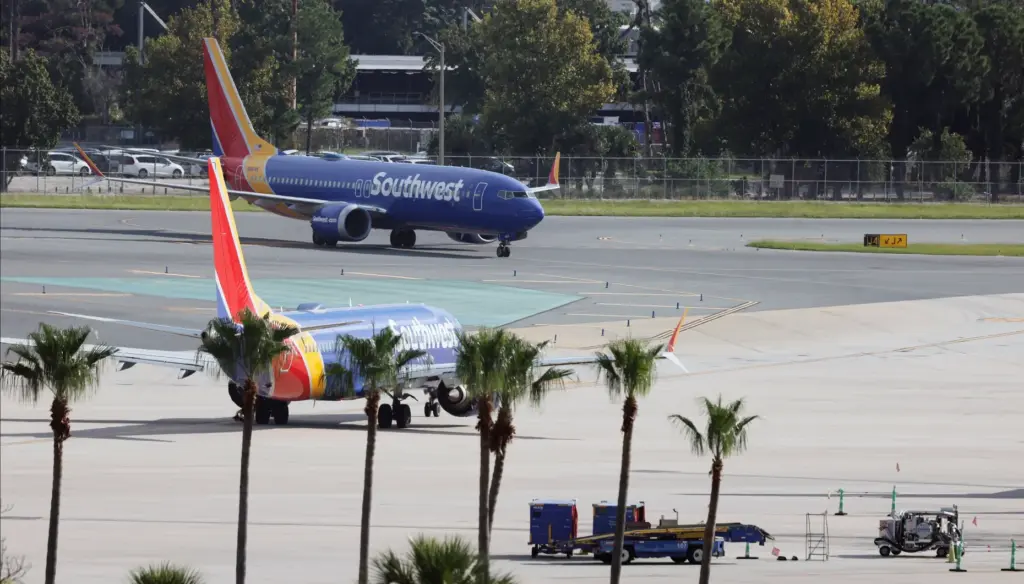 Two Southwest airliners taxi at the Orlando International Airport, on...