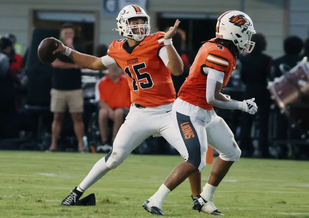 Oviedo quarterback Sebastian Galeano (15) throws during the Oviedo High...