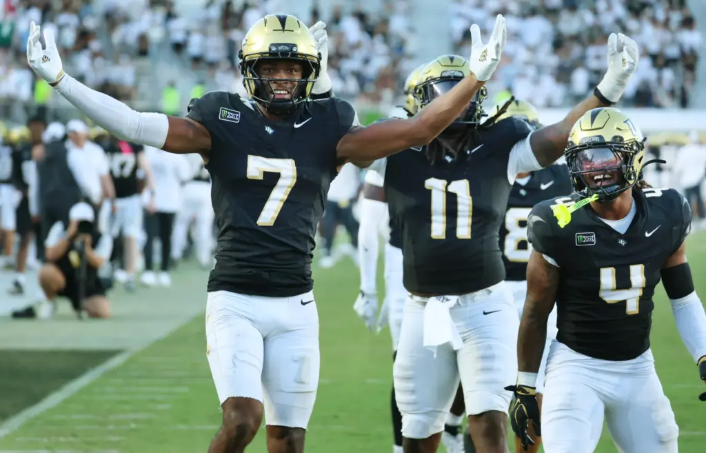 UCF players Antione Jackson (7), Ken Talley (11), Braeden Marshall...