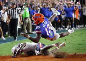 Philo, Baugh lead explosive Gators past FAU in Sumrall’s record-setting debut 66-21