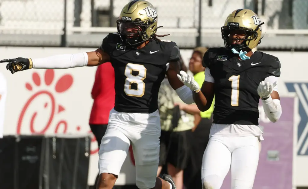 UCF defensive backs Demari Henderson (8) and Jayden Bellamy (1)...