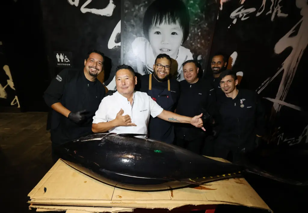 Chefs are pictured with a giant tuna during the Sushi...