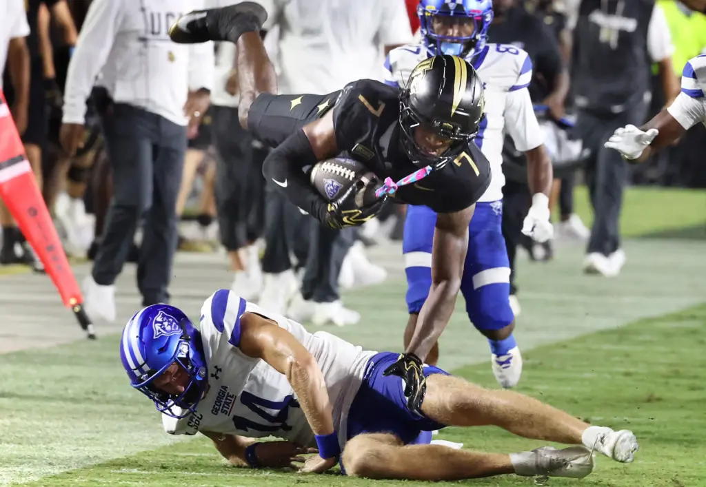 UCF defensive back Antione Jackson (7) leaps over Georgia State...