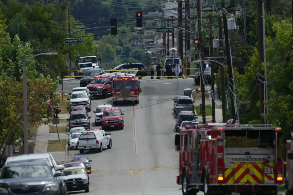 Firetrucks blocked off roads following a reported chemical leak, Tuesday,...