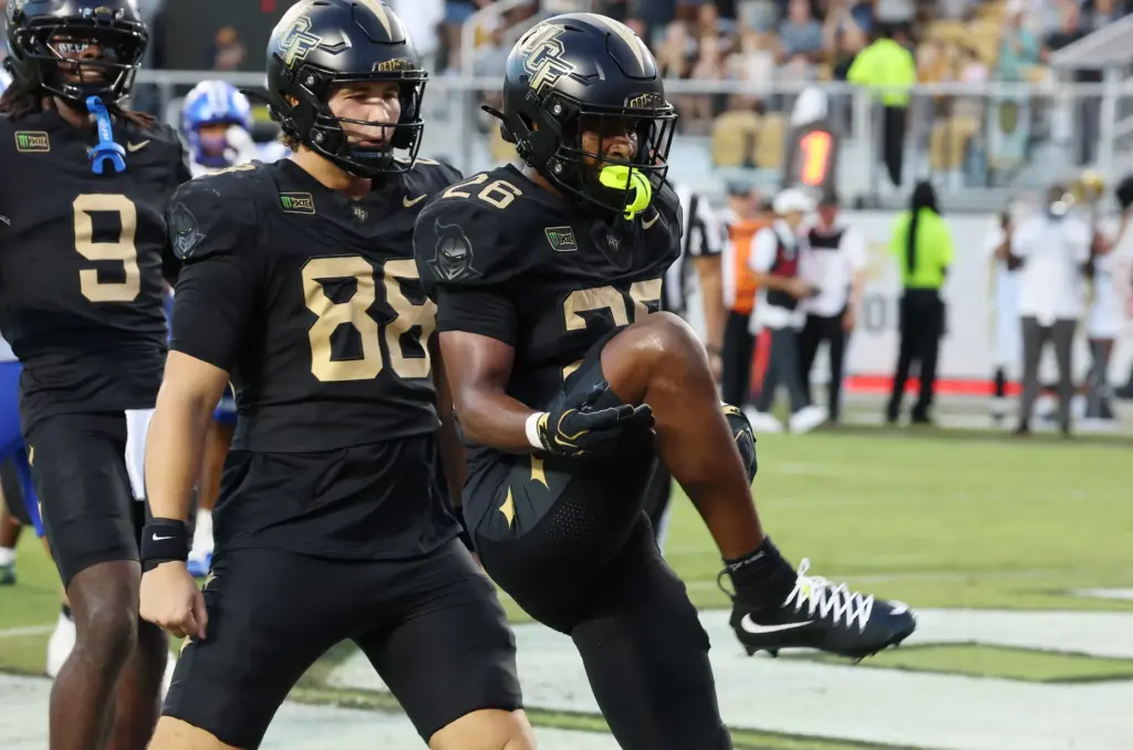UCF running back Duke Watson (26) celebrates after scoring a...