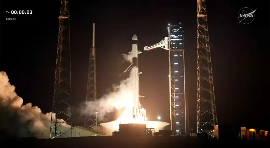 A SpaceX Falcon 9 with the Crew Dragon Freedom launches...