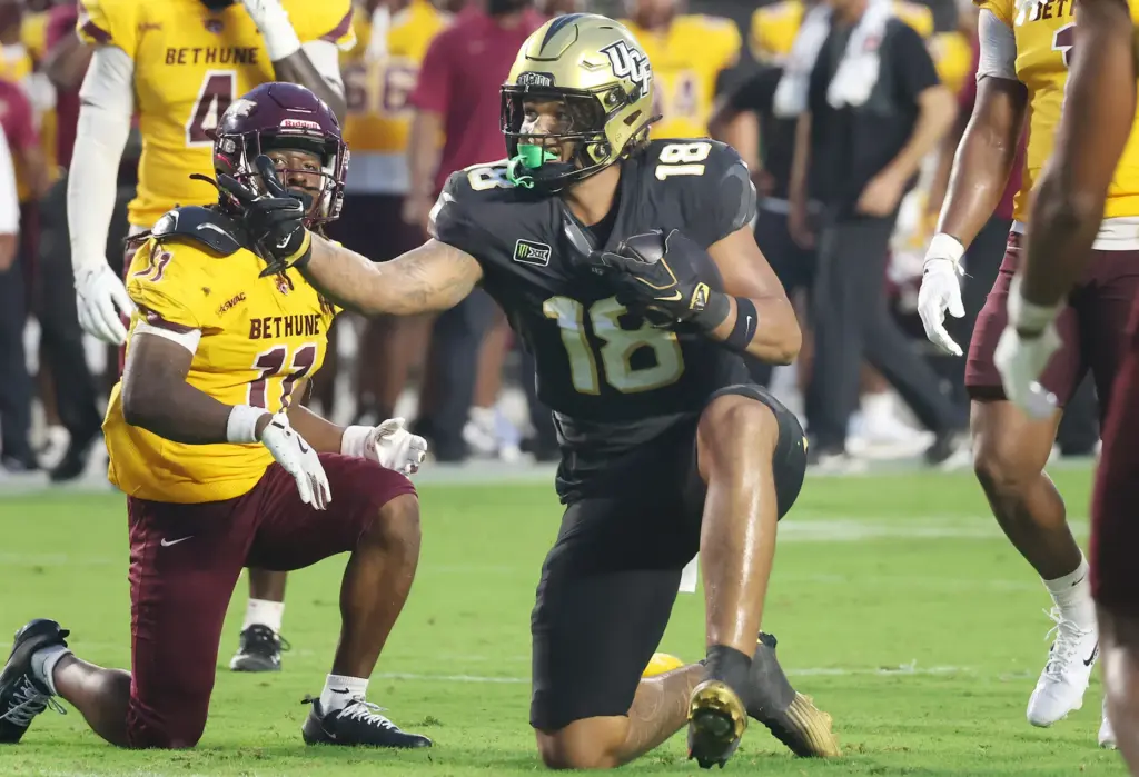 UCF tight end Caden Piening (18) celebrates a first-down catch...