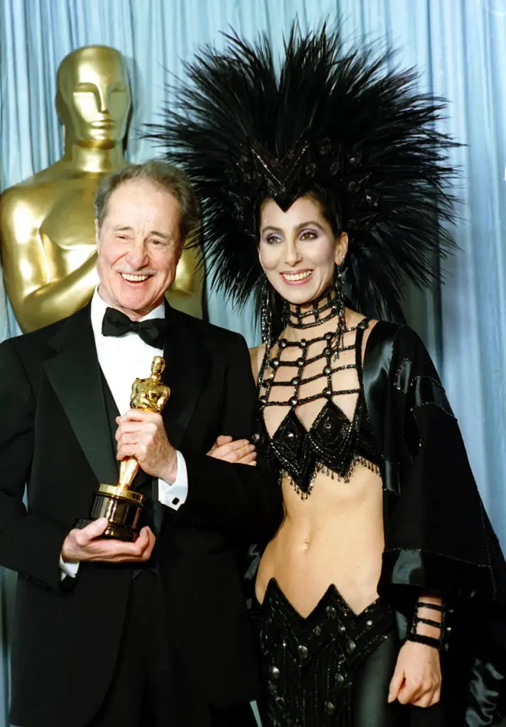 FILE – Actress-singer Cher wears a creation by designer Bob...