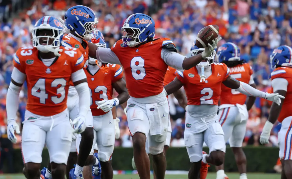 Florida linebacker Aaron Chiles (8) celebrates after a fumble recovery...
