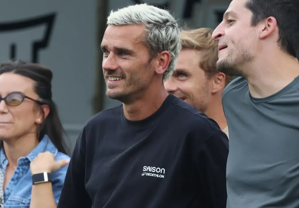 Orlando City Soccer star Antoine Griezmann watches from the sidelines...