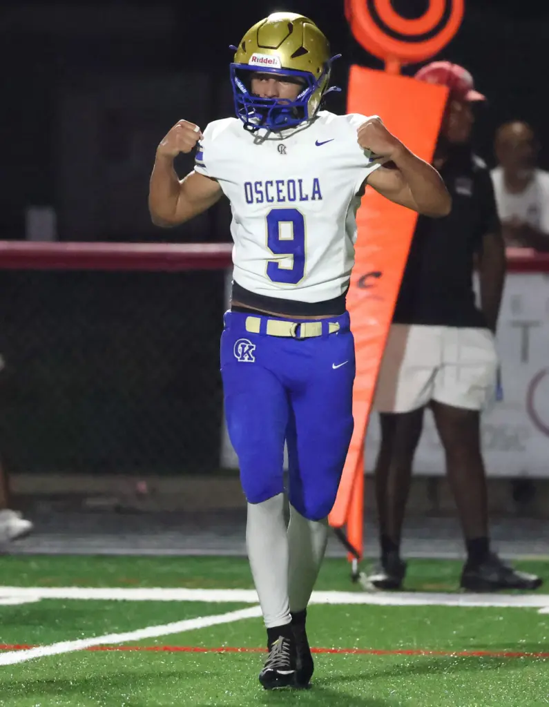 Osceola player Josue Rivera celebrates after scoring a touchdown during...