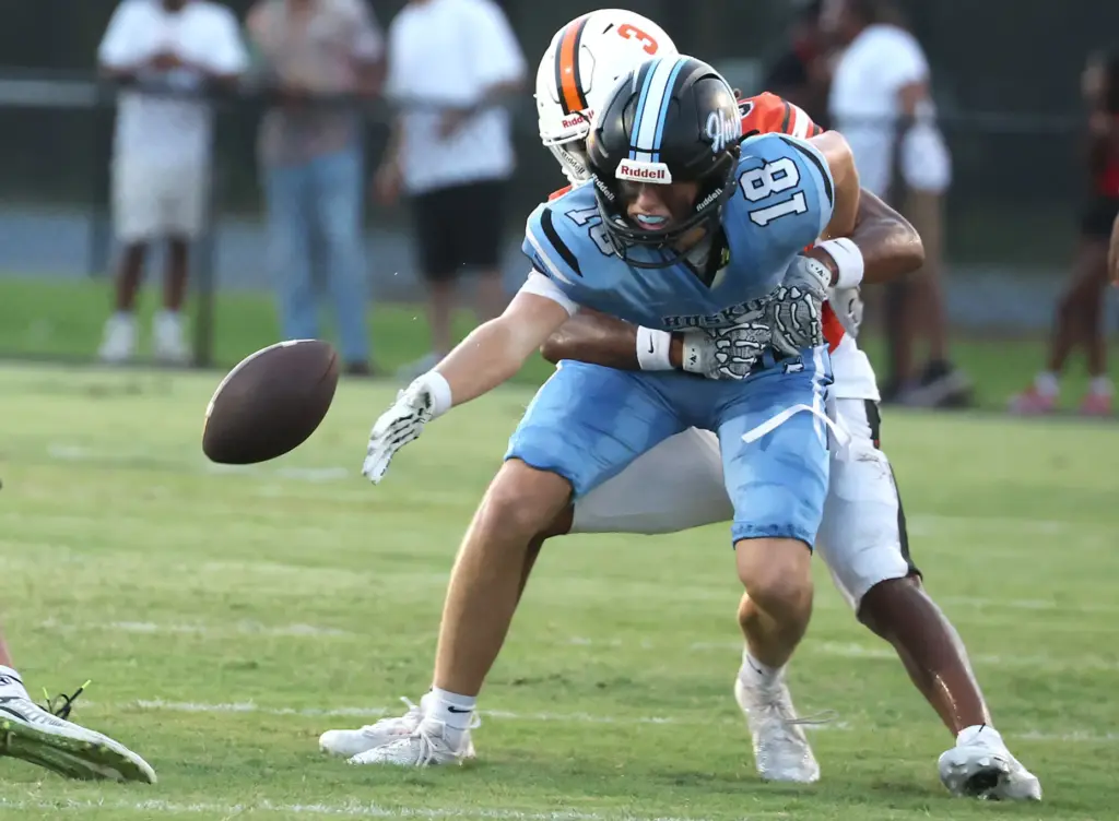 Oviedo safety safety Carmari Solomon (3) keeps Hagerty receiver Ian...