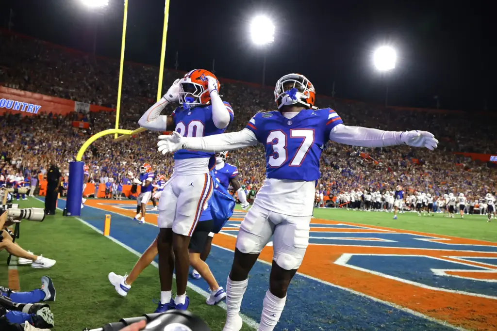 Florida players Dylan Purter (30) and Javion Toobs (37) celebrate...