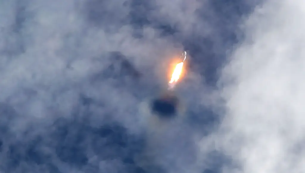 A SpaceX Falcon Heavy carves a hole through the clouds...