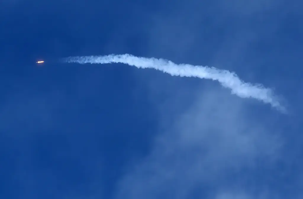 A SpaceX Falcon 9 rocket using a fleet-leading booster for...