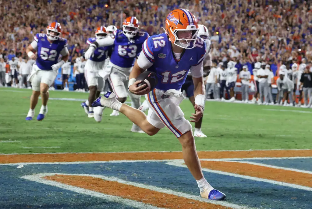 Florida quarterback Aaron Philo (12) runs for a touchdown during...