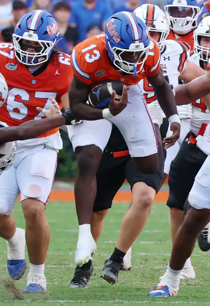 Florida running back Jadan Baugh (13) leaps during the Campbell...