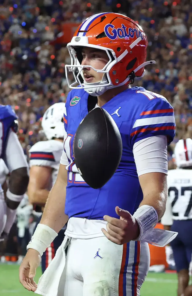 Florida quarterback Aaron Philo (12) celebrates after running for a...
