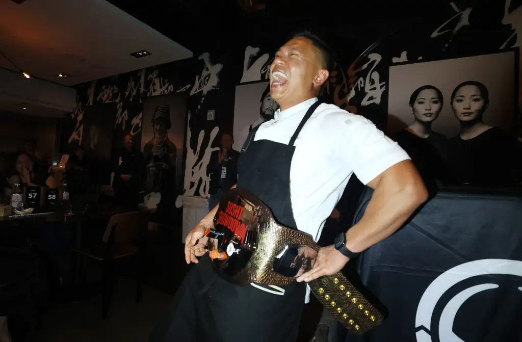 Chef Chau Trinh of Sushi Pop proudly dons the Sushi...