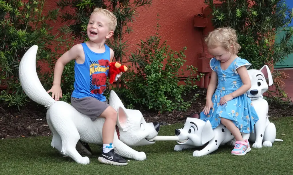 Toddler-sized Disney dogs Bolt and Dalmatians in a tug of...