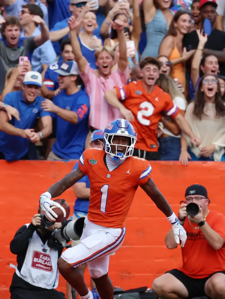 Florida receiver Vernell Brown III (1) returns a punt for...