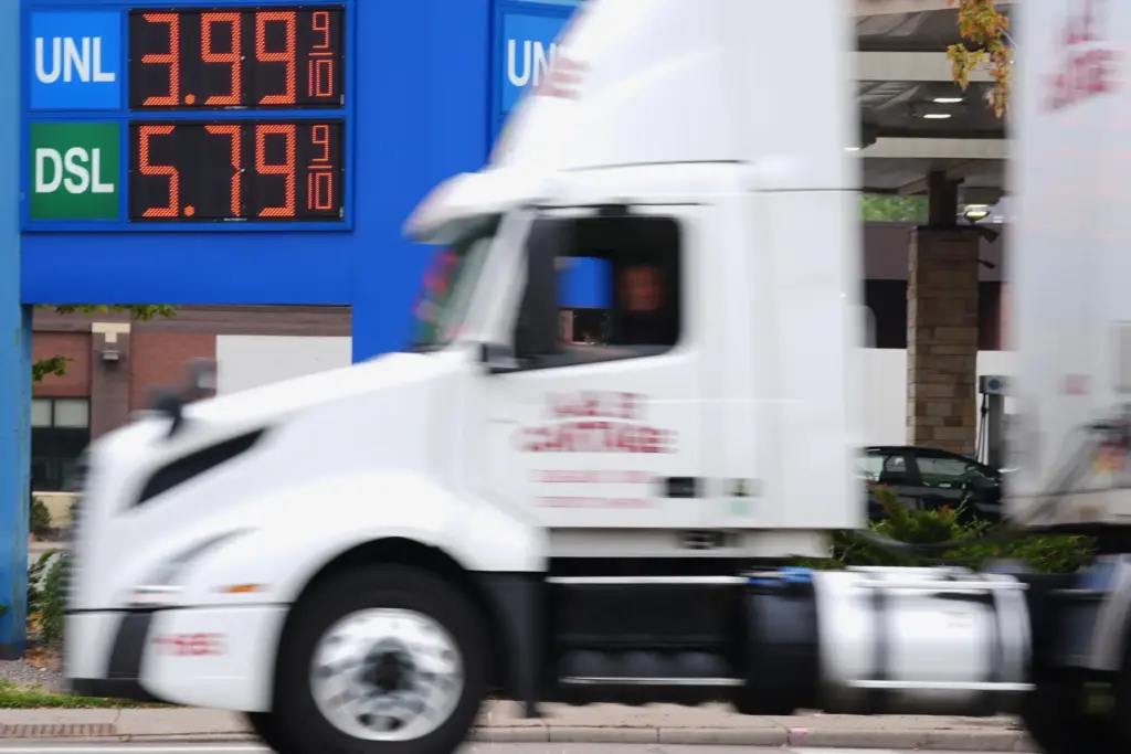 Diesel prices are displayed at a gas station as prices hit a record high.